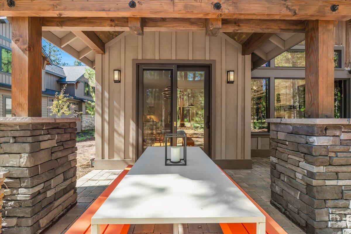 56278 Sable Rock Loop Bend, OR 97707 - Photo 39 of 54 a view of a patio with table and chairs