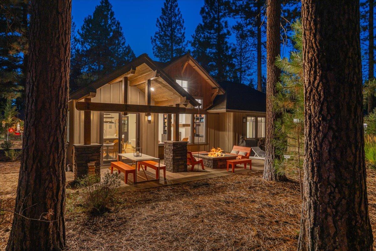 56278 Sable Rock Loop Bend, OR 97707 - Photo 49 of 54 a backyard of a house with a yard fountain and outdoor seating