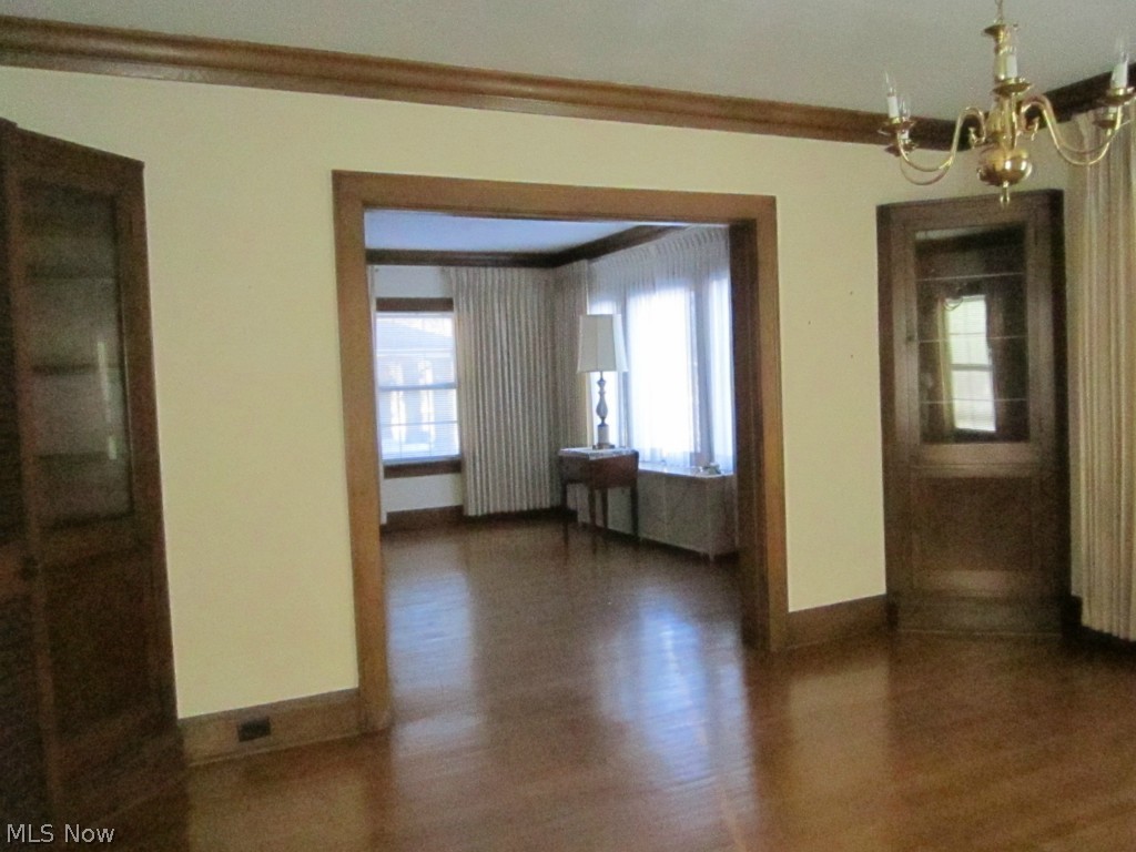 233 East Schaaf Road Independence, OH 44131 - Photo 2 of 22 Dining room with corner cabinets looking into the living room.