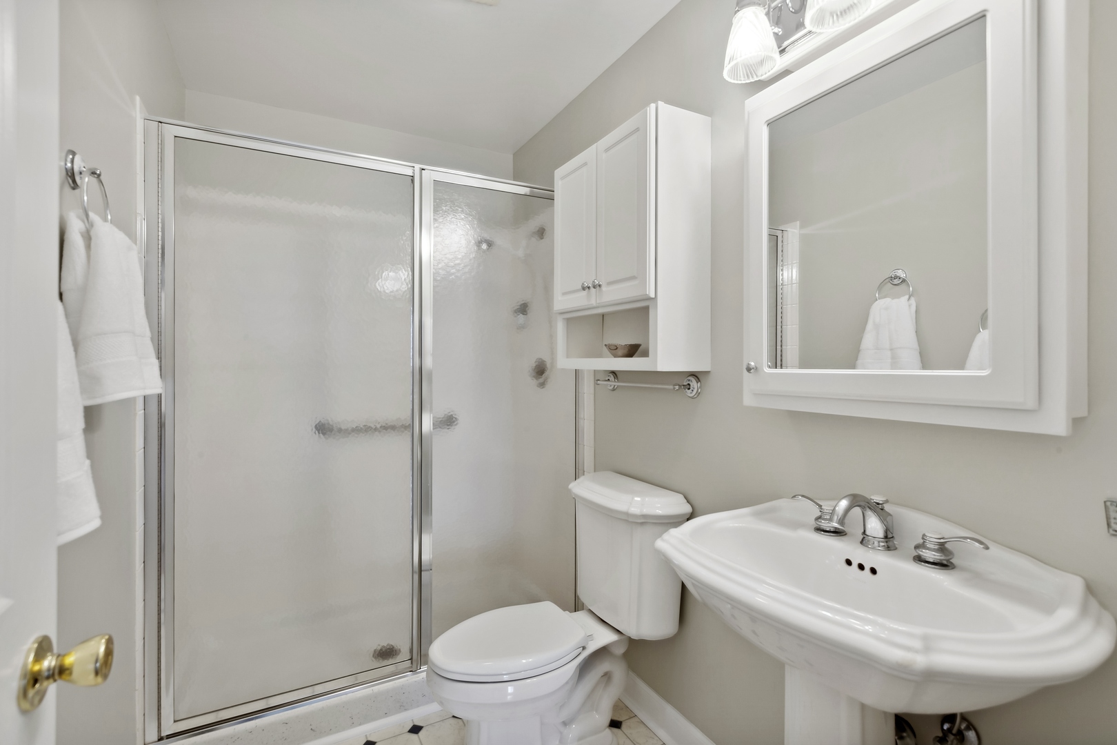 515 North Main Street, Unit 4AS Glen Ellyn, IL 60137 - Photo 11 of 23 a bathroom with a sink a toilet and shower