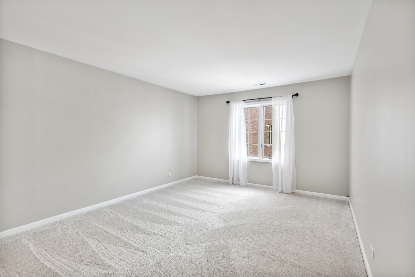 515 North Main Street, Unit 4AS Glen Ellyn, IL 60137 - Photo 12 of 23 a view of an empty room with a window