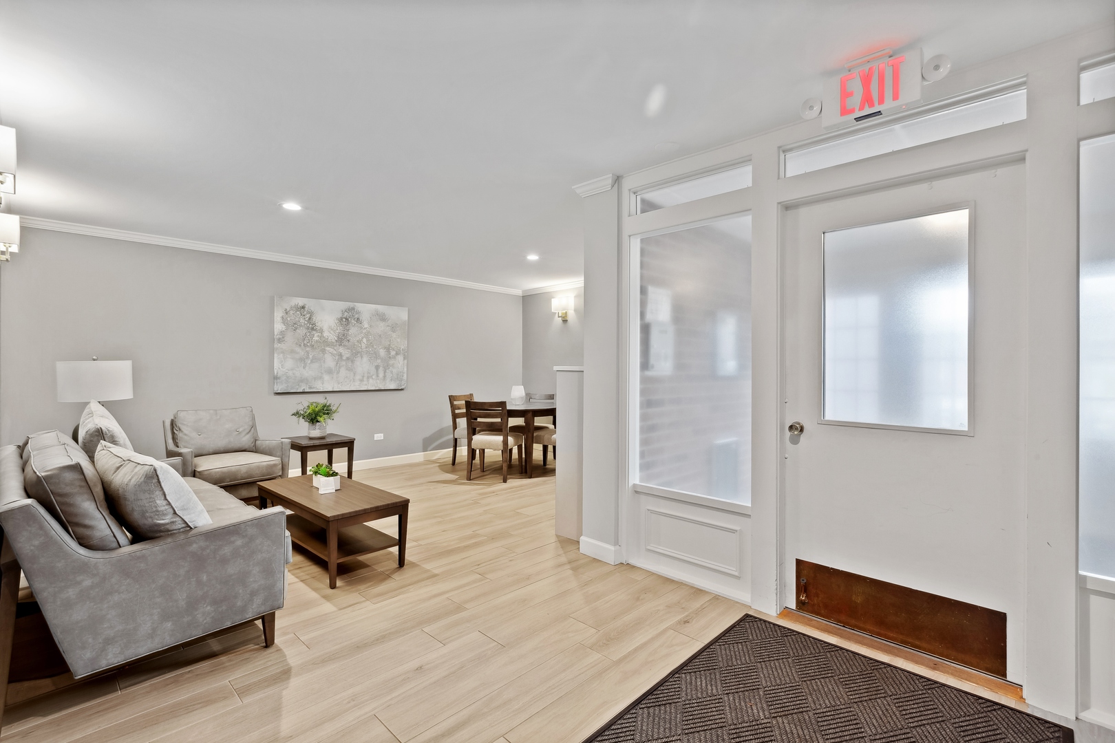 515 North Main Street, Unit 4AS Glen Ellyn, IL 60137 - Photo 2 of 23 a living room with furniture and a wooden floor