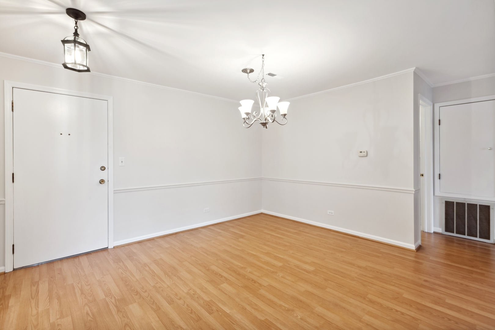 515 North Main Street, Unit 4AS Glen Ellyn, IL 60137 - Photo 3 of 23 a view of a room with wooden floor