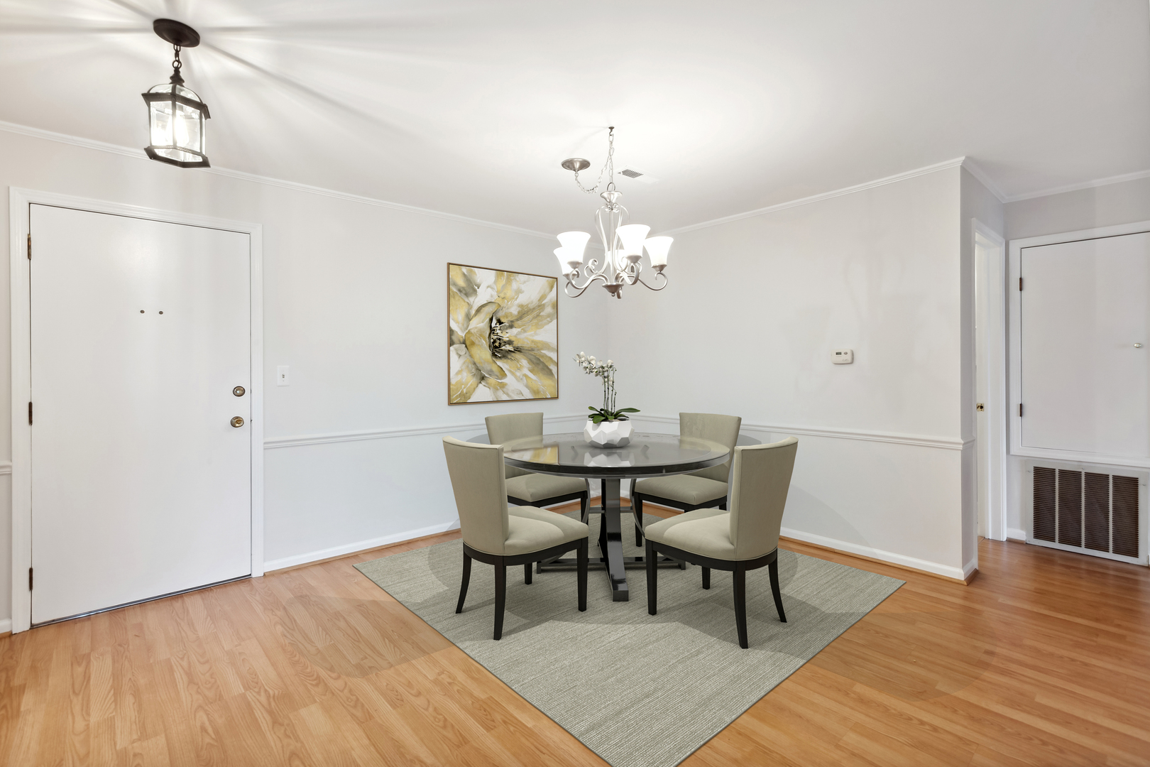 515 North Main Street, Unit 4AS Glen Ellyn, IL 60137 - Photo 4 of 23 a dining room with furniture wooden floor a rug and a chandelier
