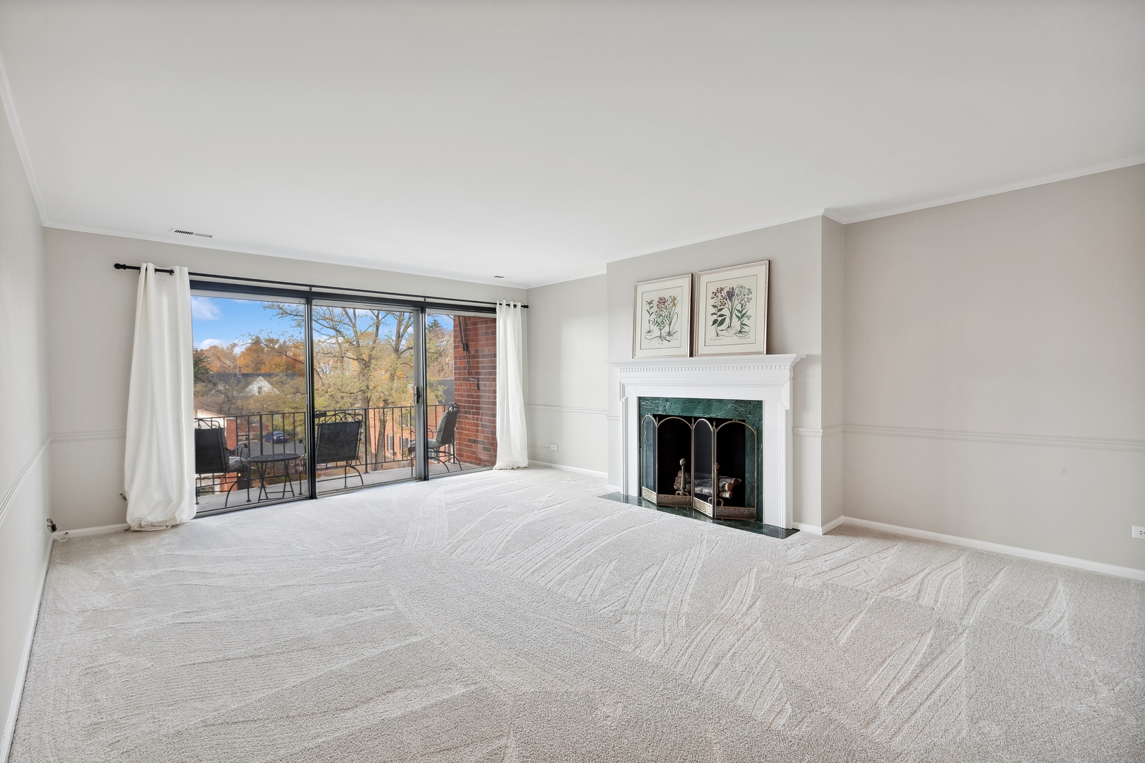 515 North Main Street, Unit 4AS Glen Ellyn, IL 60137 - Photo 6 of 23 a view of an empty room with window and a fireplace