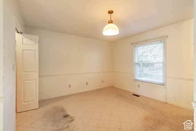 386 North 210 East Mapleton, UT 84664 - Photo 16 of 30 Neutral-toned walls, overhead lighting fixture, window with blinds, carpeted flooring, and a paneled door