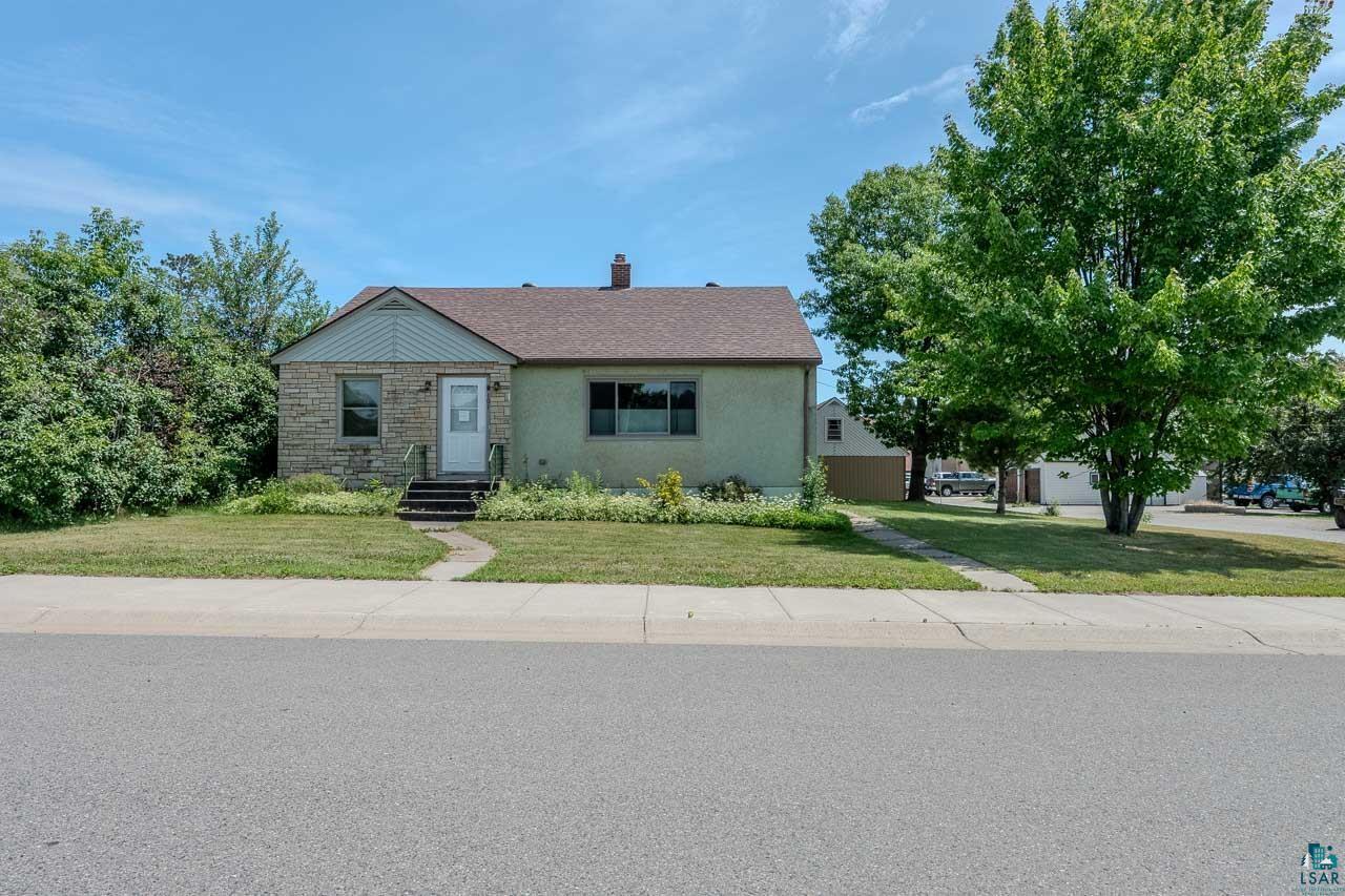 101 2nd Avenue North Biwabik, MN 55708 - Photo 1 of 44 Ranch-style residence featuring a stone facade accent, light stucco exterior, and asphalt shingle roof