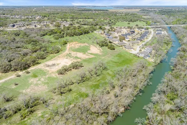 a view of a lake with a tree