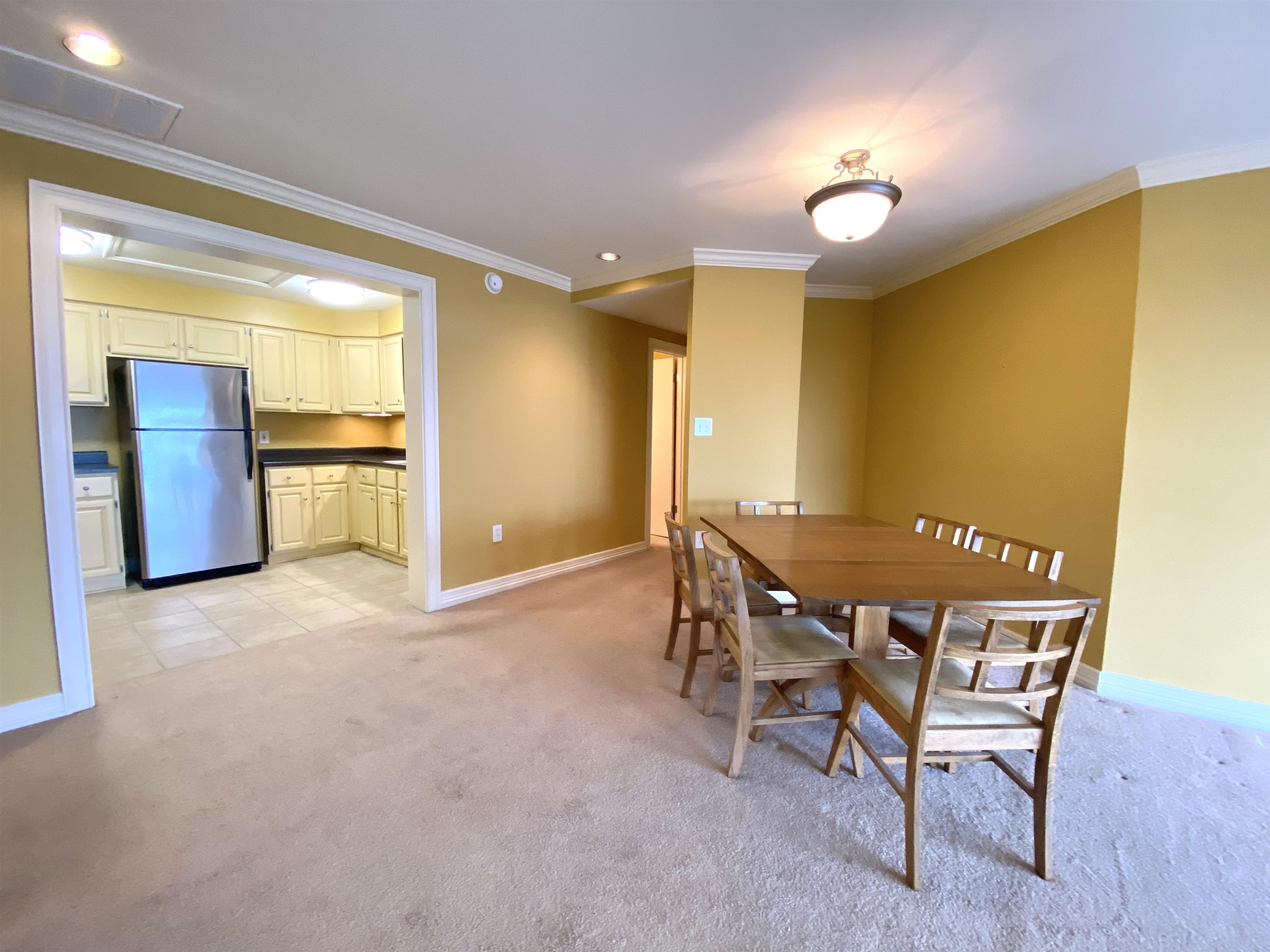 655 Riverside Drive, Unit 1104B Memphis, TN 38103 - Photo 8 of 20 a view of a dining room with furniture and a window