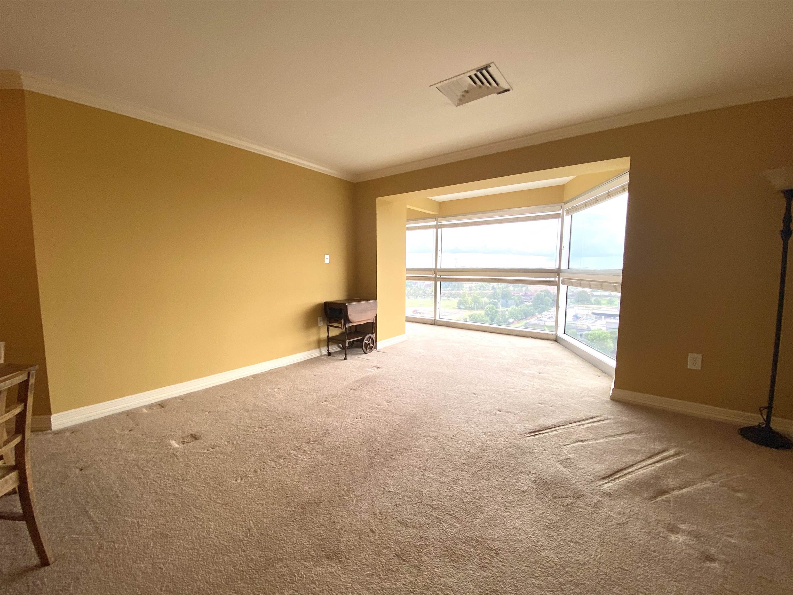 655 Riverside Drive, Unit 1104B Memphis, TN 38103 - Photo 9 of 20 a view of an empty room with a window