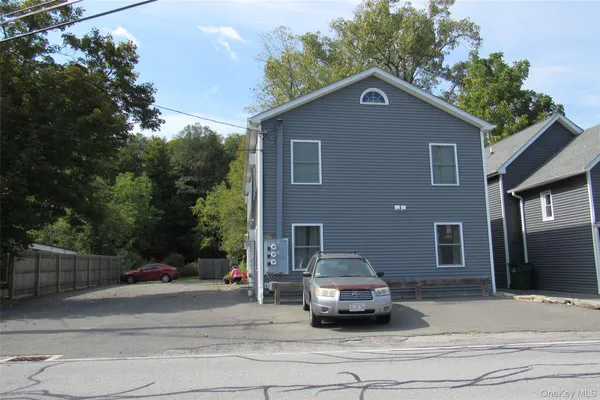 a car parked in front of a house