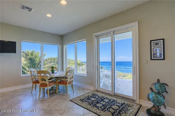 a dining room with furniture and a window