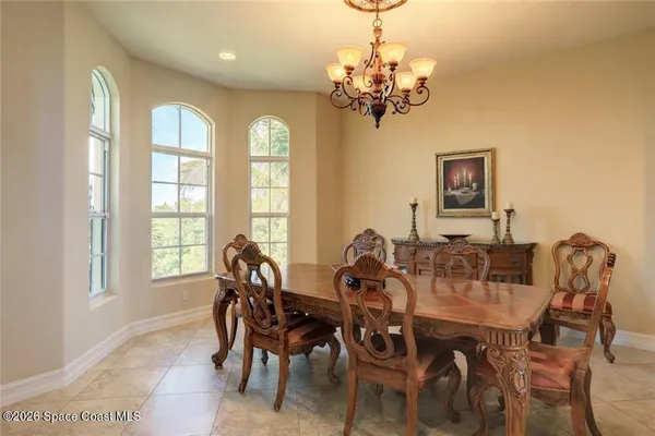 a view of a dining room with furniture window and outside view