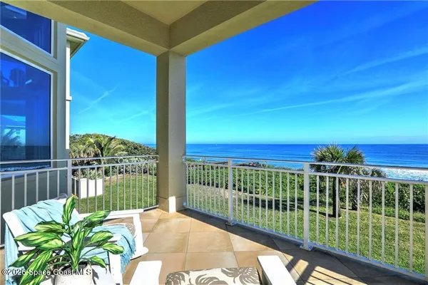 a view of a balcony with lake view