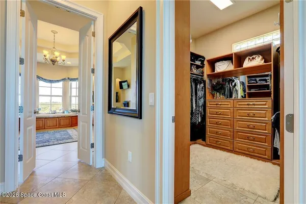 a view of an entryway door and an outdoor kitchen
