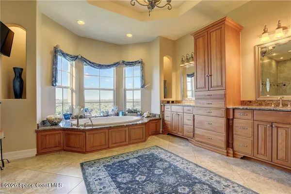 a large room with a large window and furniture