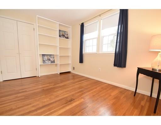 80 Robbins Road Sudbury, MA 01776 - Photo 12 of 16 a view of an empty room with wooden floor and a window