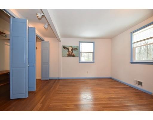 80 Robbins Road Sudbury, MA 01776 - Photo 7 of 16 a view of an empty room with wooden floor and a window