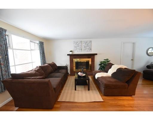 80 Robbins Road Sudbury, MA 01776 - Photo 8 of 16 a living room with furniture and a fireplace