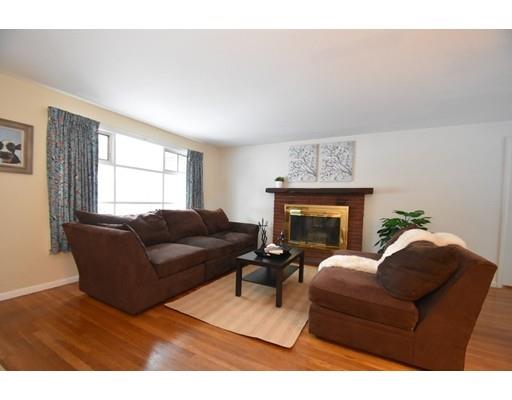 80 Robbins Road Sudbury, MA 01776 - Photo 10 of 16 a living room with furniture a fireplace and a large mirror