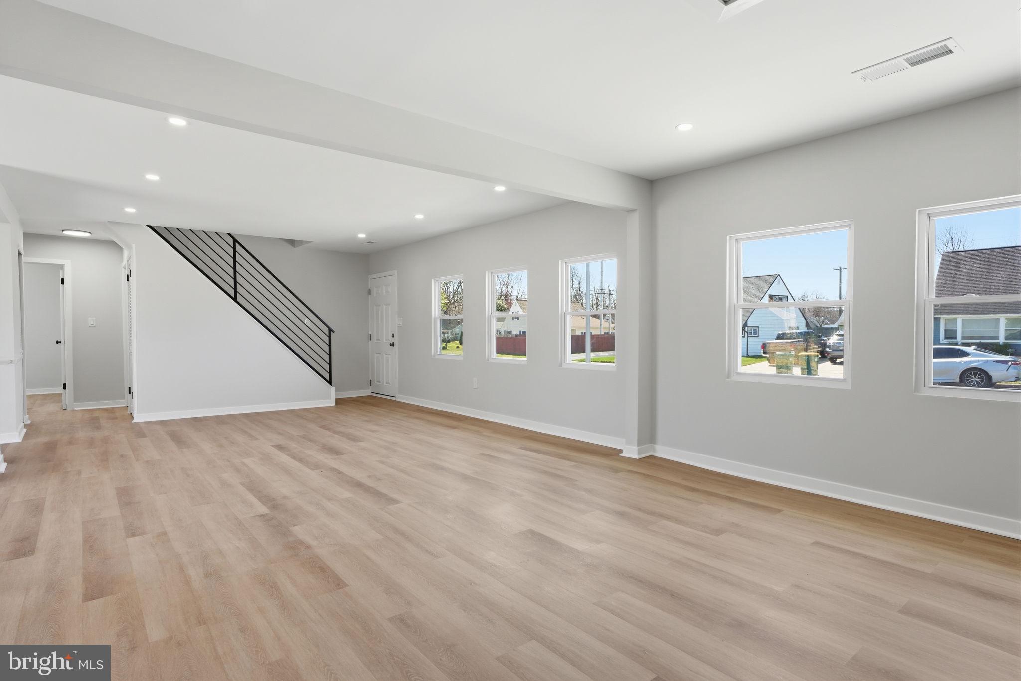 10 MacIntosh Road Levittown, PA 19056 - Photo 11 of 41 an empty room with wooden floor and windows