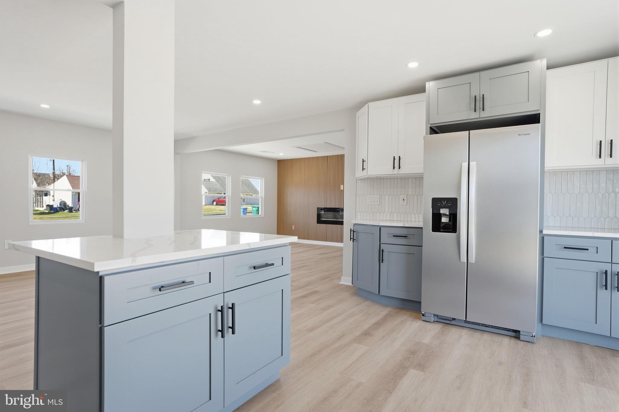 10 MacIntosh Road Levittown, PA 19056 - Photo 16 of 41 a kitchen with white cabinets and stainless steel appliances