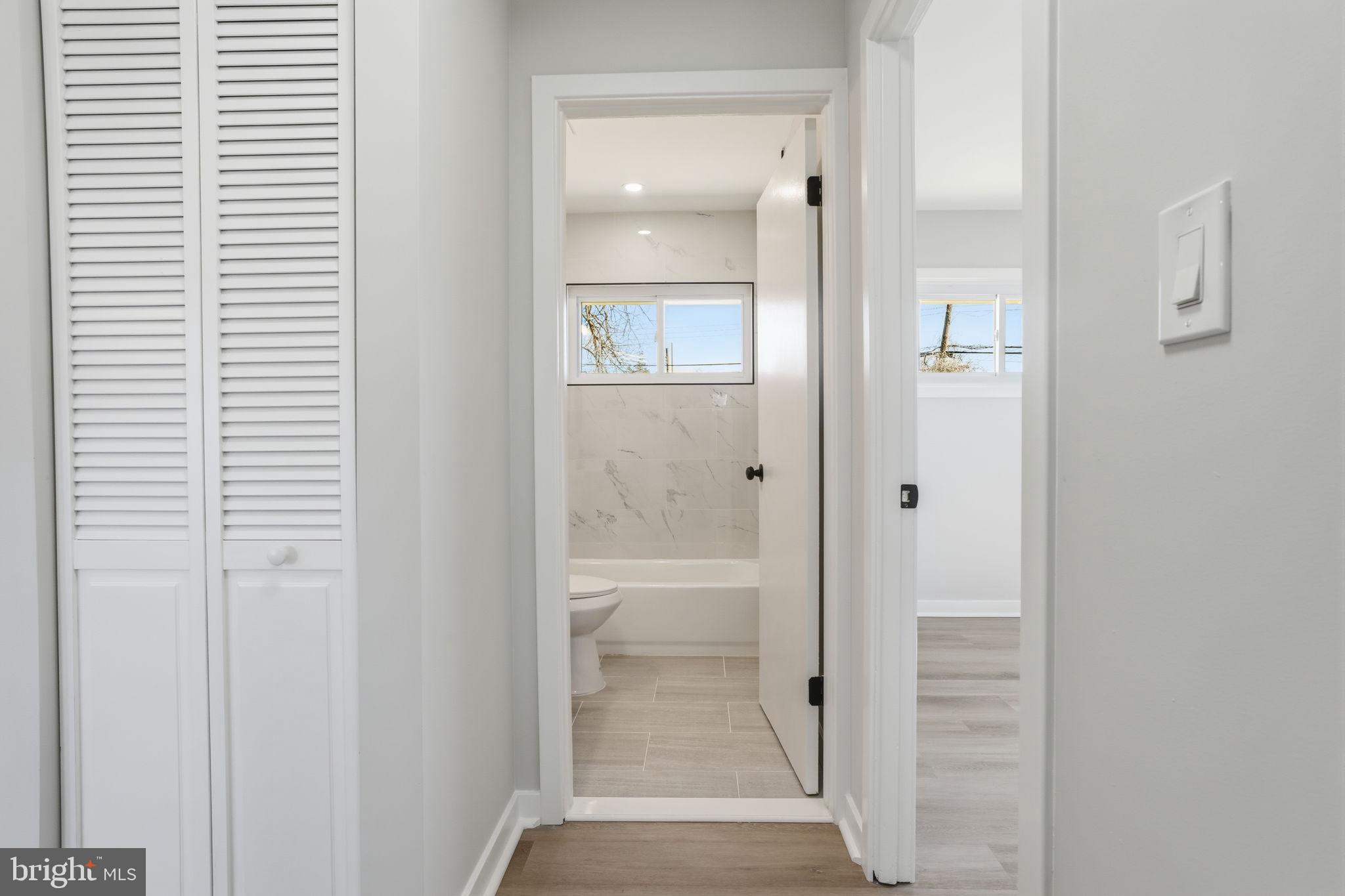 10 MacIntosh Road Levittown, PA 19056 - Photo 21 of 41 a bathroom with a glass shower door