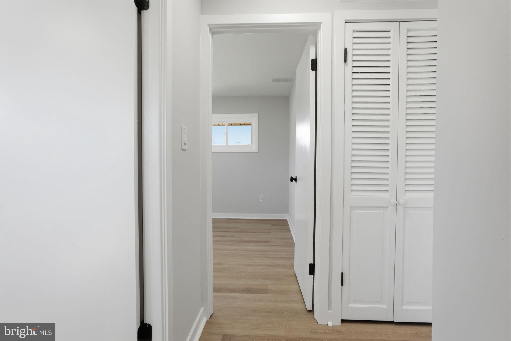 10 MacIntosh Road Levittown, PA 19056 - Photo 25 of 41 a view of a hallway with wooden floor