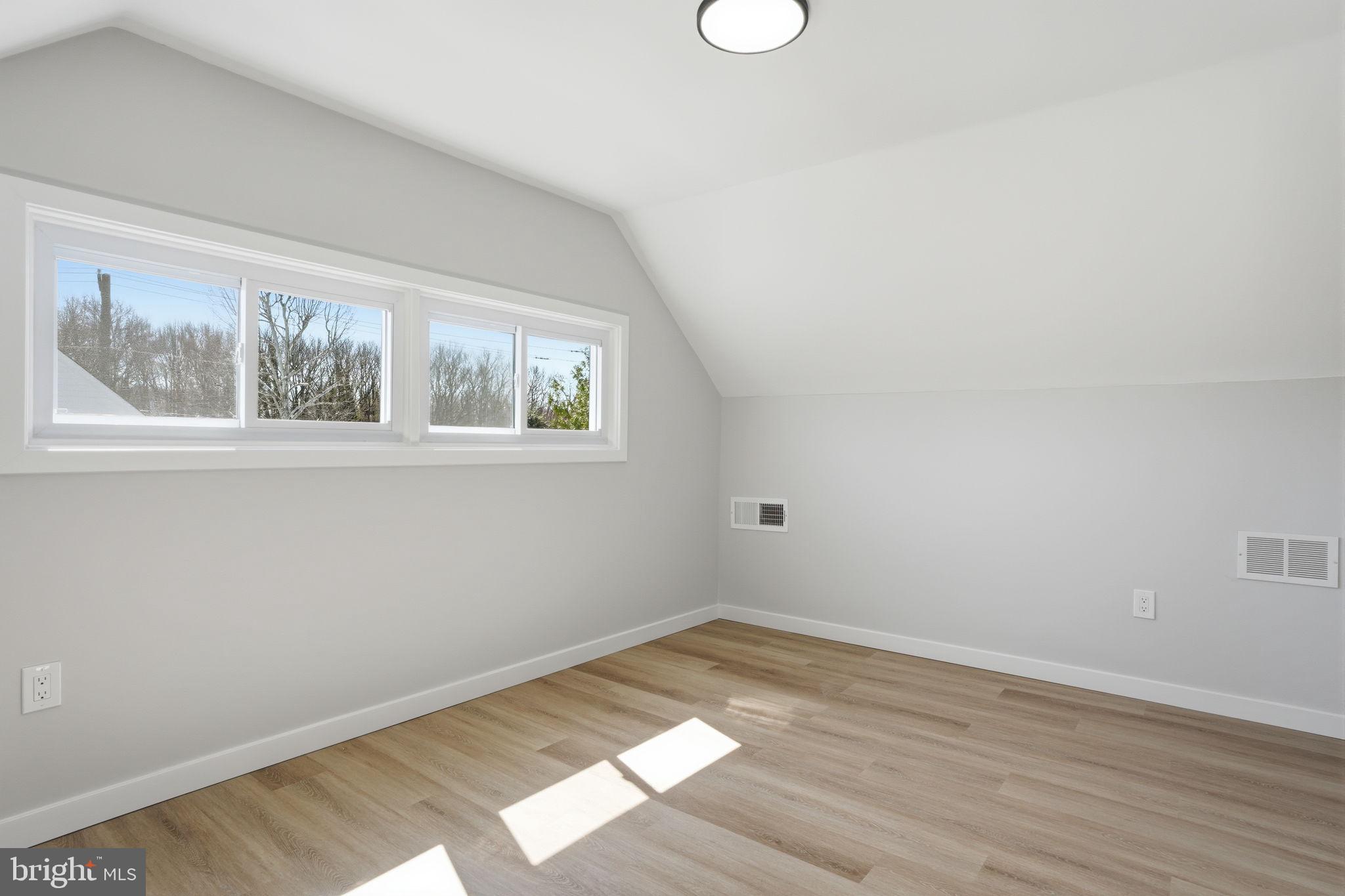10 MacIntosh Road Levittown, PA 19056 - Photo 34 of 41 a view of empty room with wooden floor and fan
