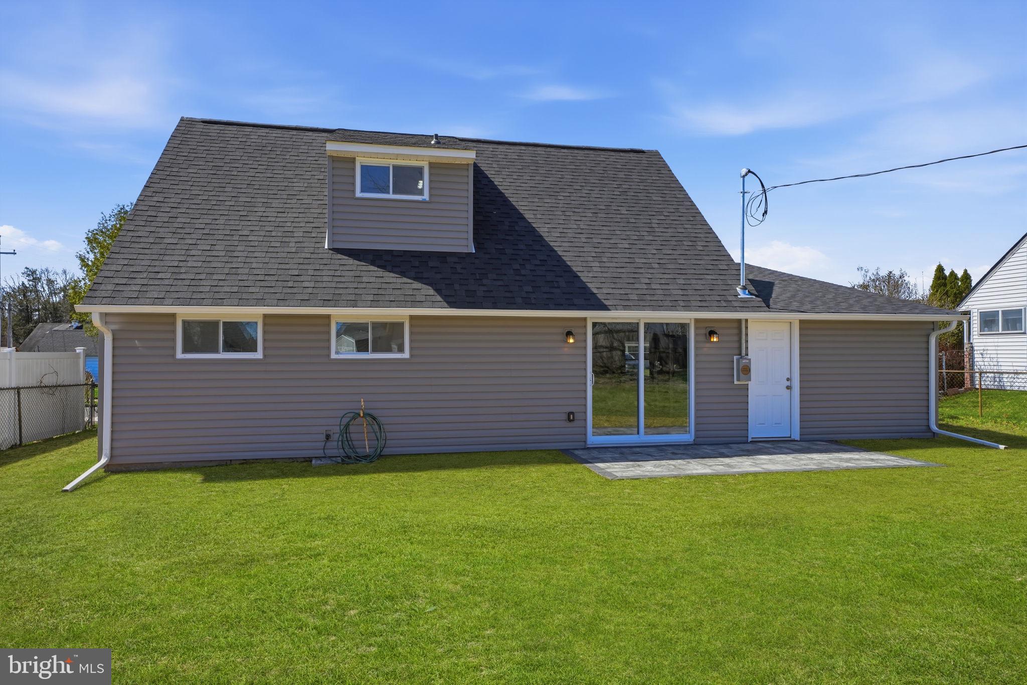 10 MacIntosh Road Levittown, PA 19056 - Photo 37 of 41 front view of a house with a yard