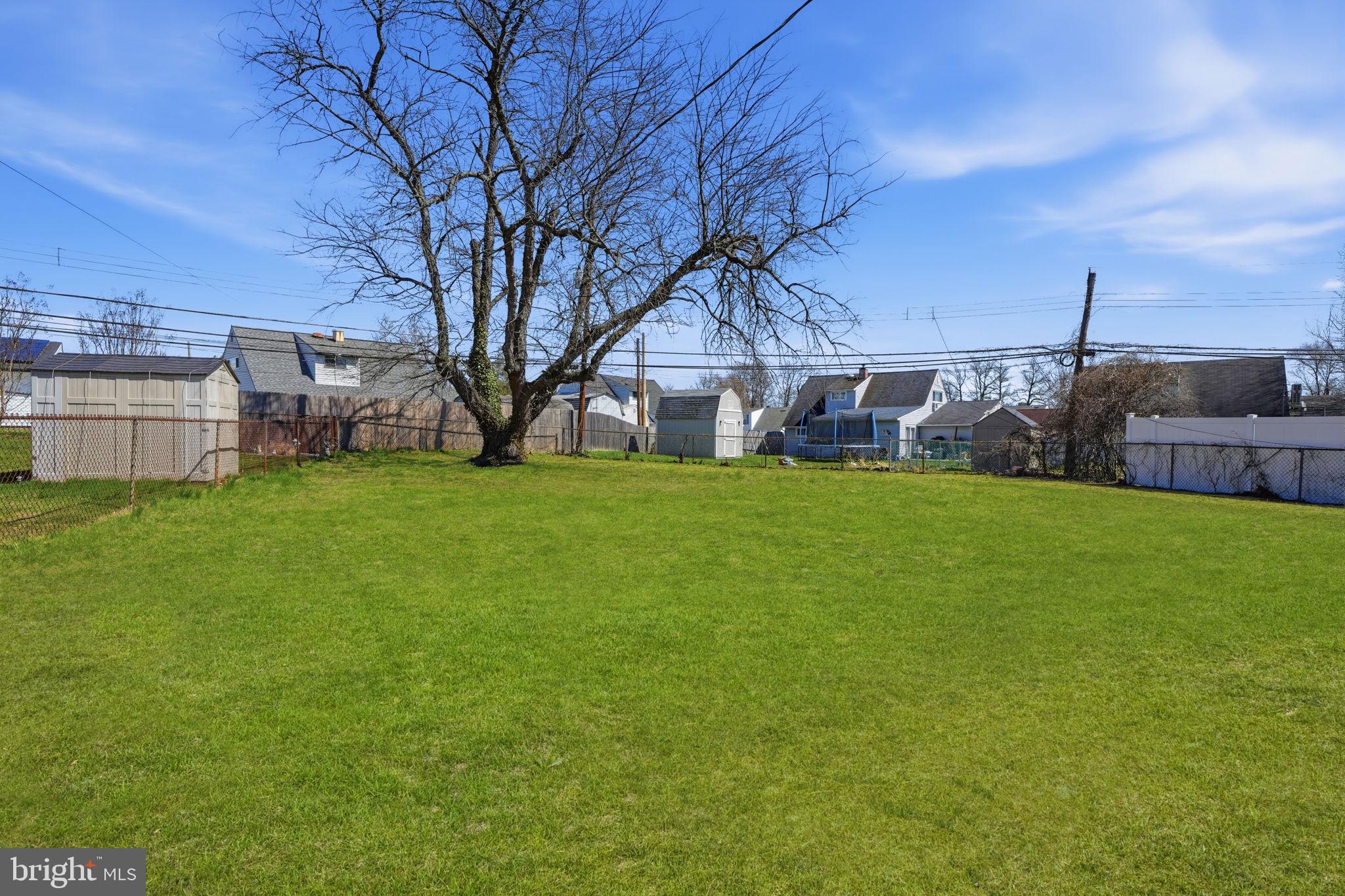 10 MacIntosh Road Levittown, PA 19056 - Photo 39 of 41 a view of a house with a big yard and large tree