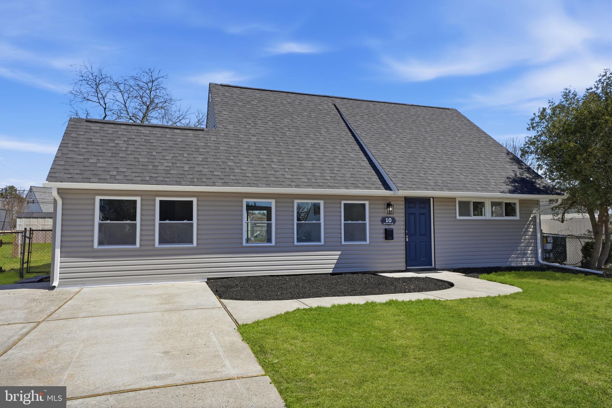 10 MacIntosh Road Levittown, PA 19056 - Photo 41 of 41 a front view of a house with a yard and trees
