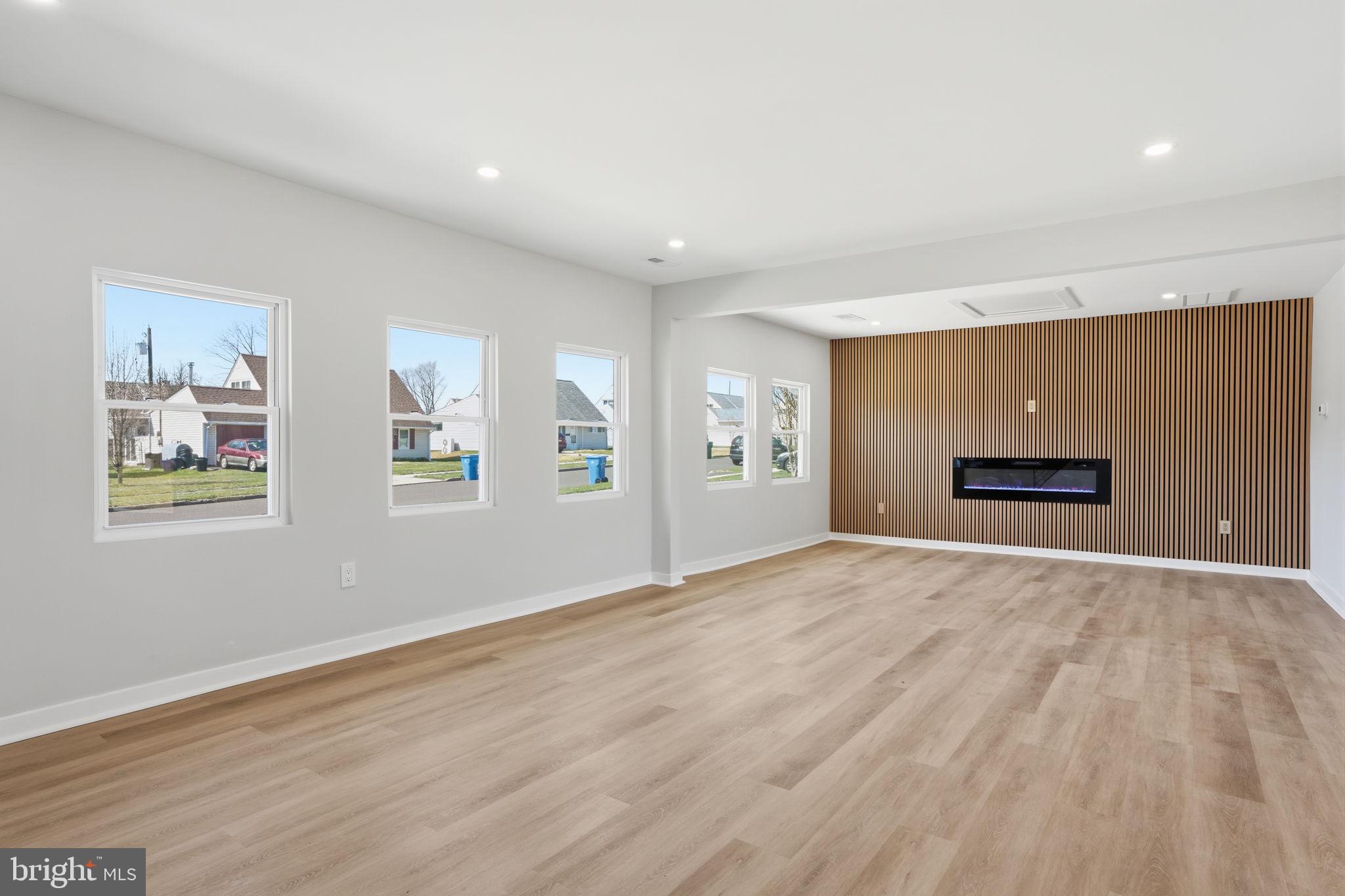 10 MacIntosh Road Levittown, PA 19056 - Photo 6 of 41 a view of an empty room with a window