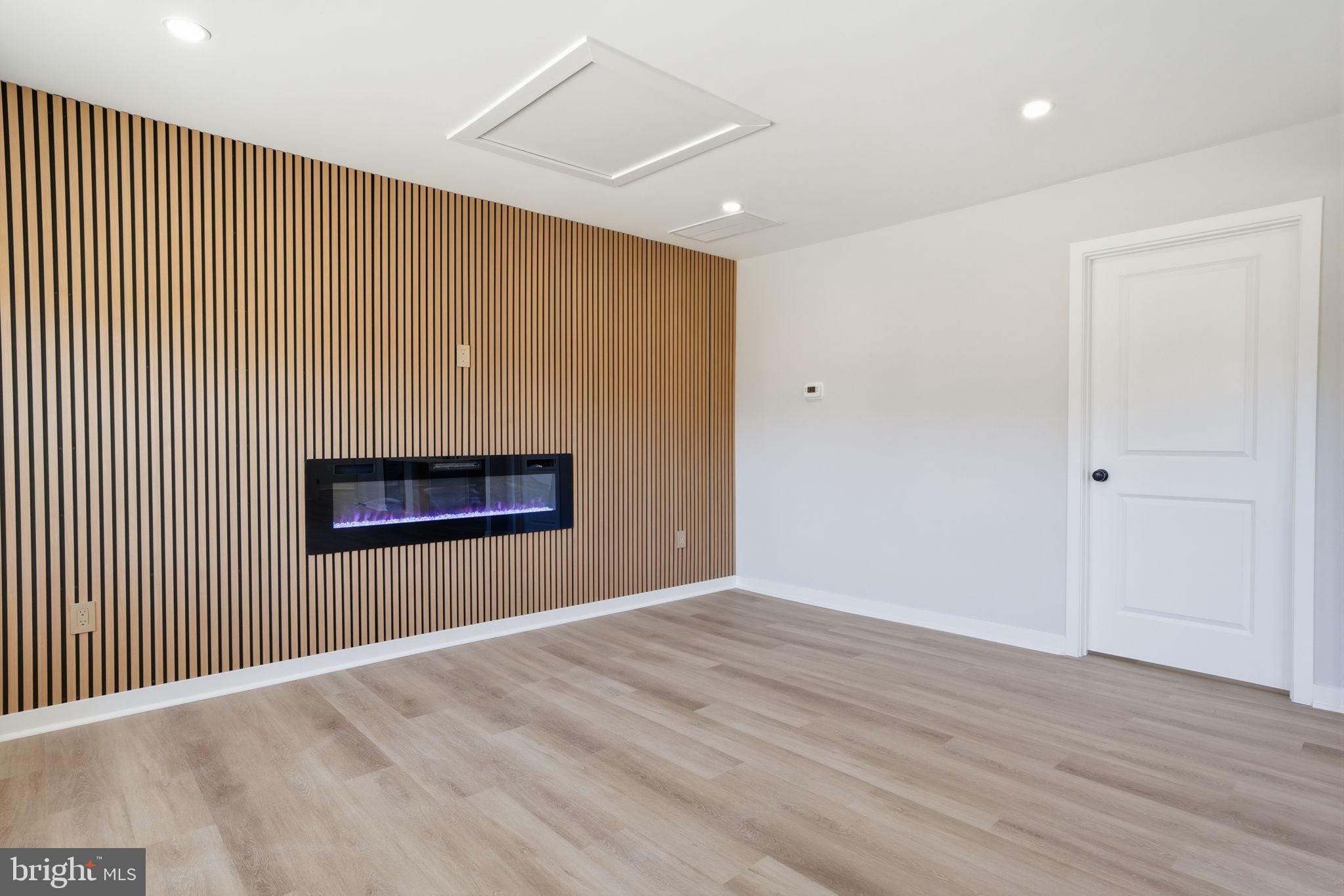10 MacIntosh Road Levittown, PA 19056 - Photo 9 of 41 an empty room with wooden floor and windows