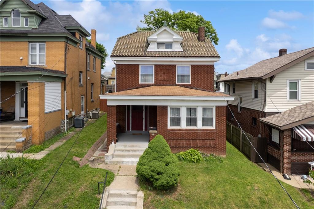 53 Calhoun Avenue Pittsburgh, PA 15210 - Photo 1 of 30 a front view of a house with a yard