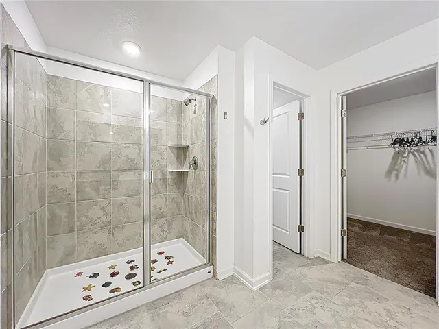 a bathroom with a bathtub and shower