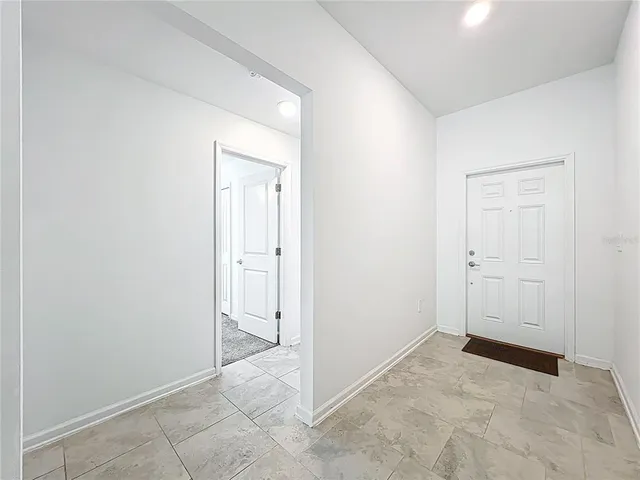 an empty room with closet area