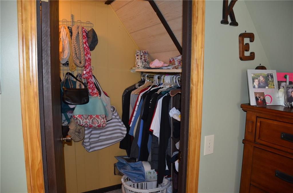 114 Walker Road Prospect, PA 16052 - Photo 14 of 25 Walk-in closet in master bedroom with additional hanging space on left.