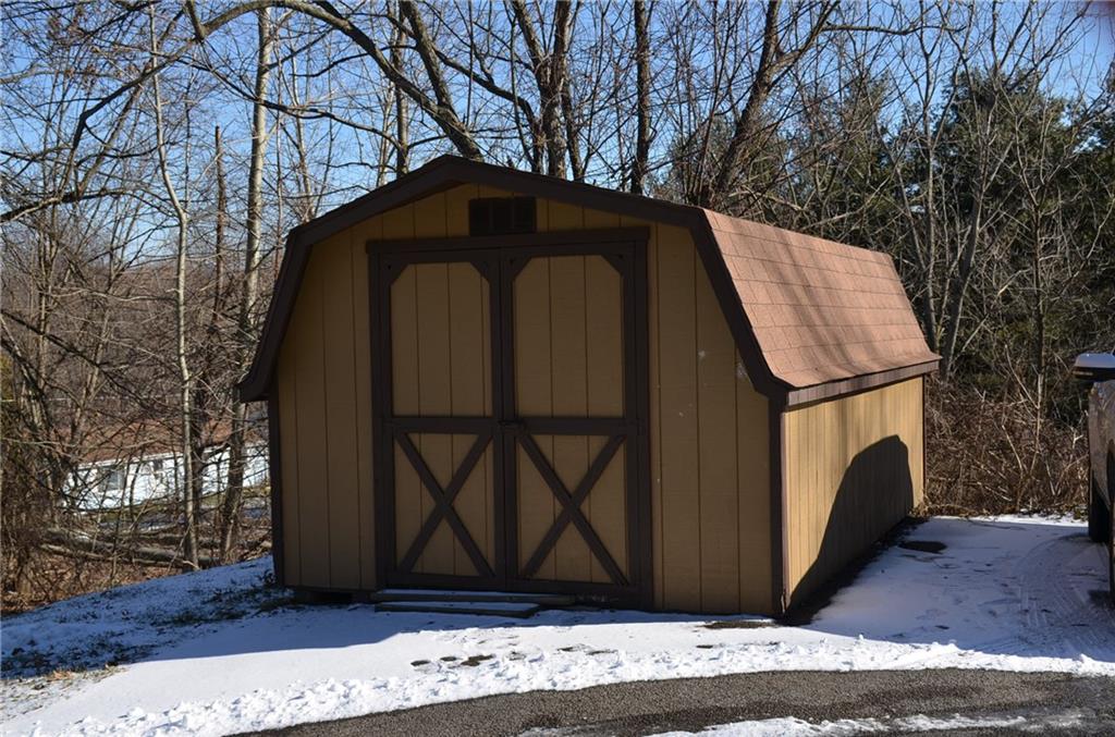 To save room in your garage there is an extra large shed.