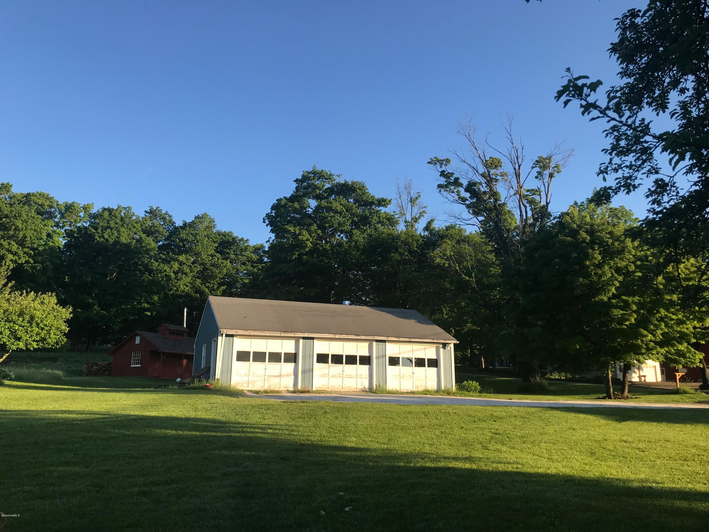 1304 Main Road Savoy, MA 01256 - Photo 2 of 28 a front view of a house with a garden