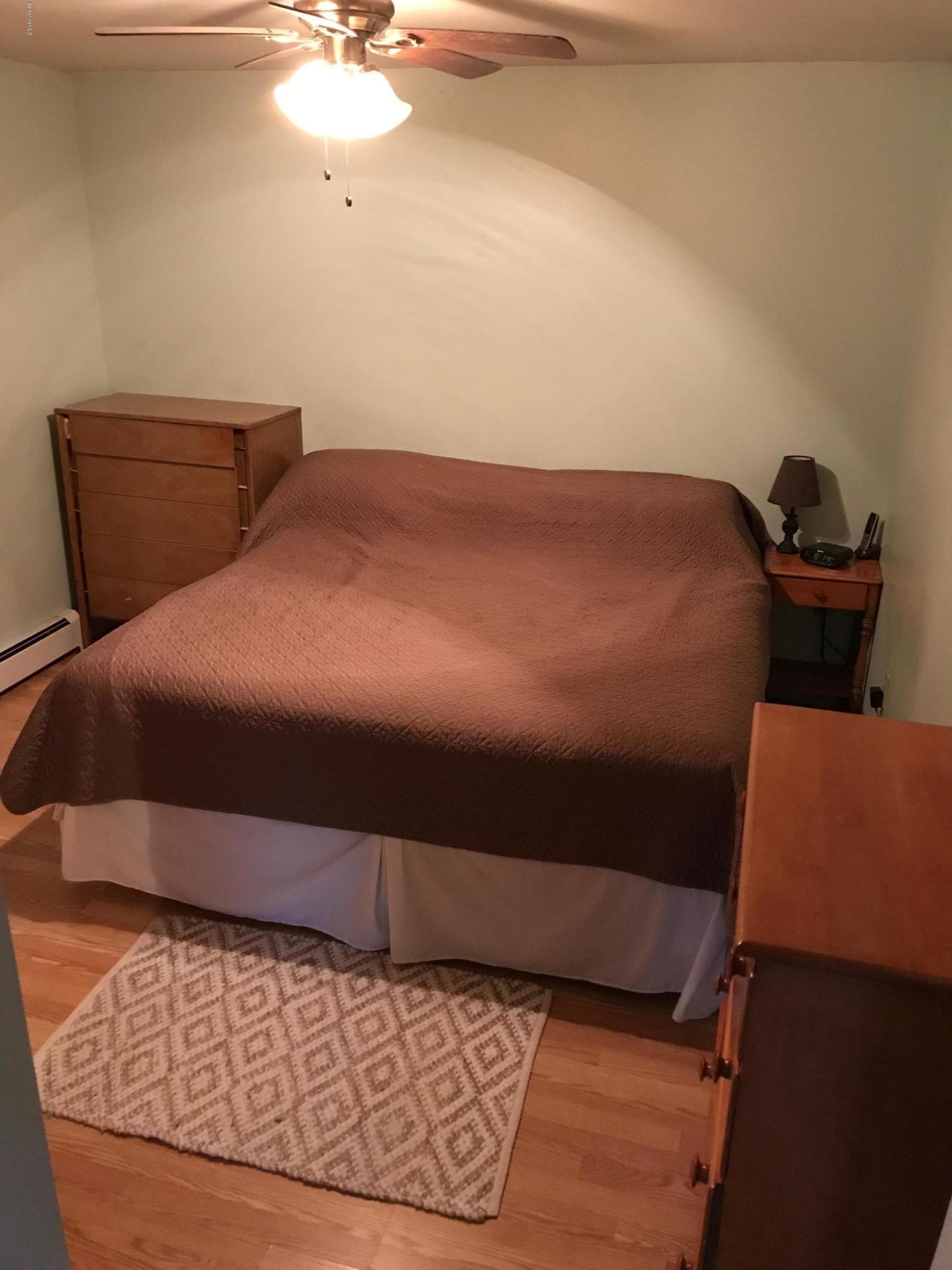 1304 Main Road Savoy, MA 01256 - Photo 15 of 28 a bedroom with a bed and a dresser