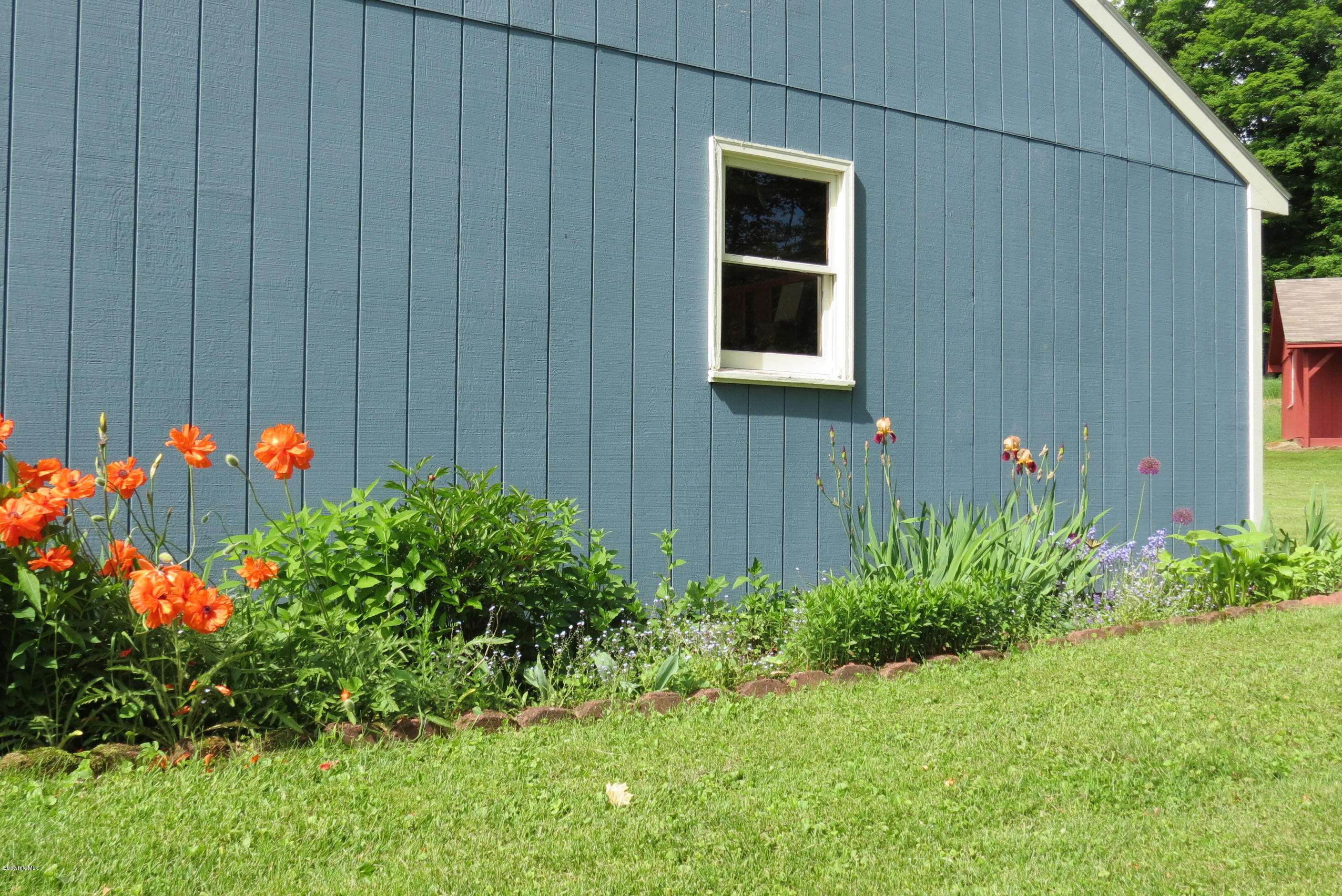 1304 Main Road Savoy, MA 01256 - Photo 20 of 28 a front view of a house with plants