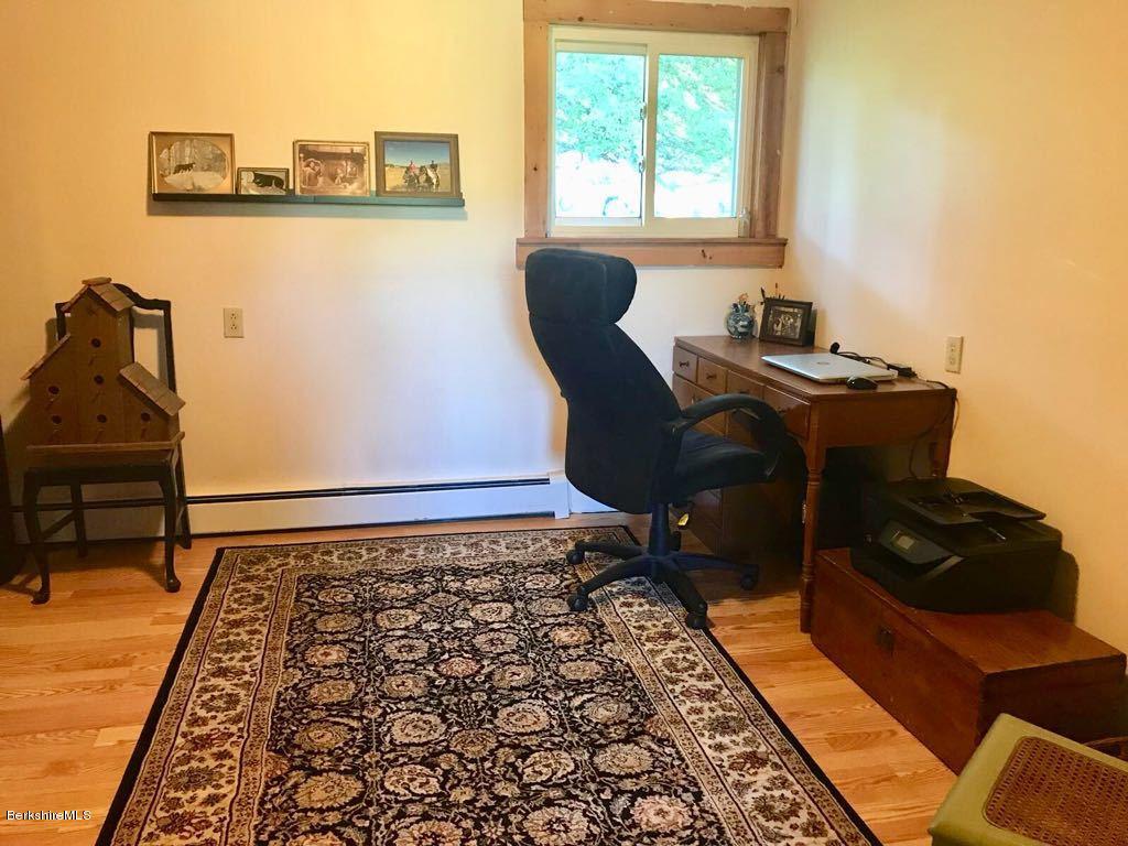 1304 Main Road Savoy, MA 01256 - Photo 3 of 28 a view of a workspace with furniture and a window