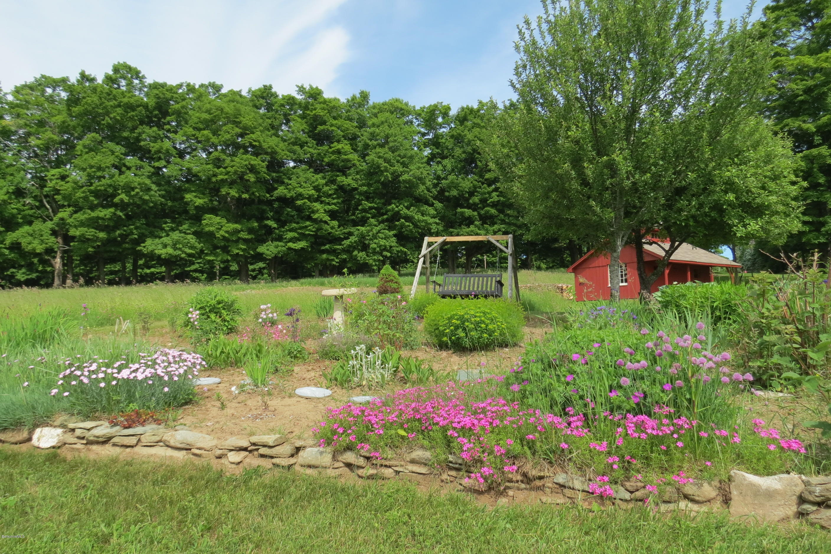 1304 Main Road Savoy, MA 01256 - Photo 27 of 28 a front view of a house with a yard and fountain