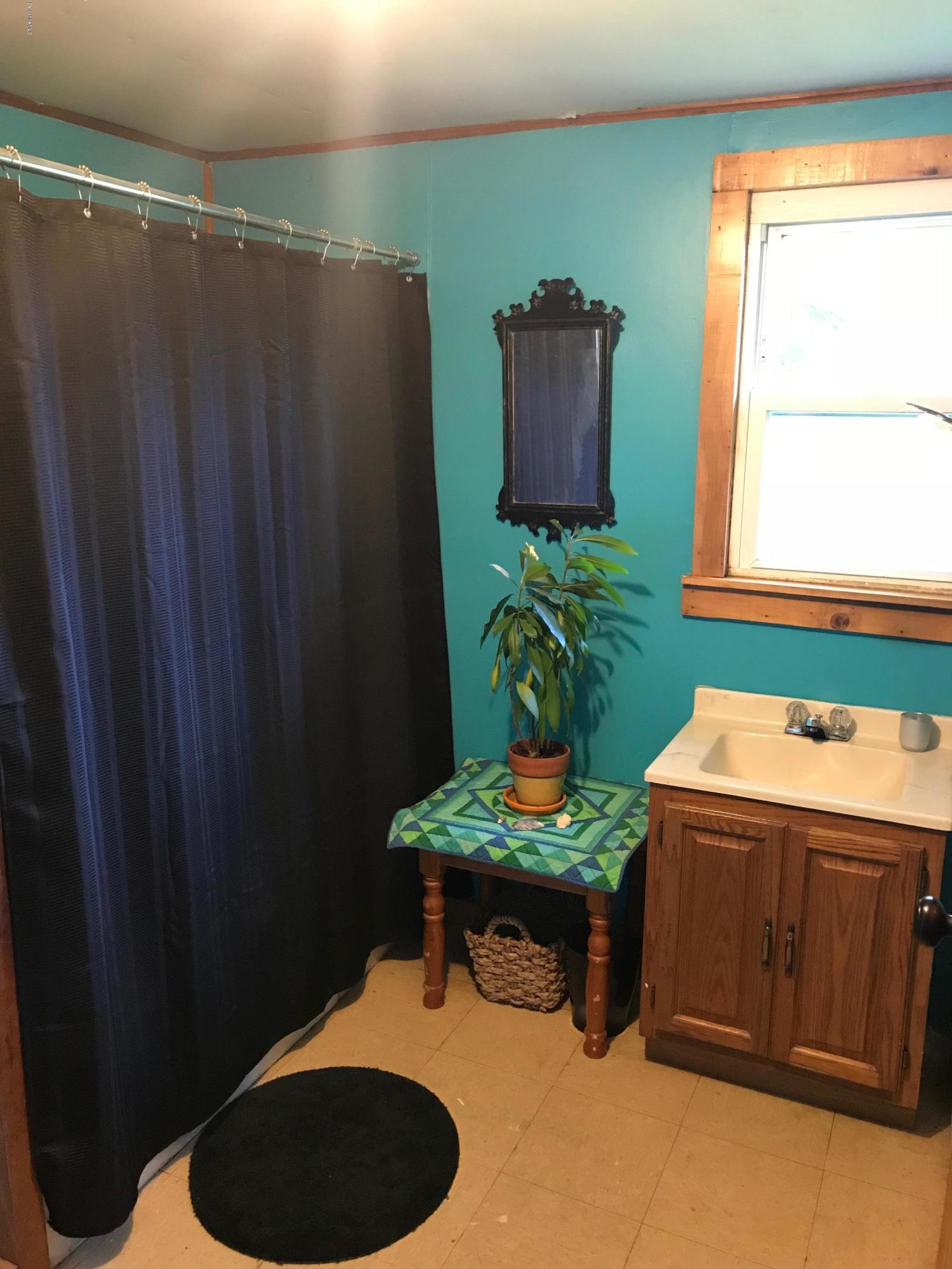 1304 Main Road Savoy, MA 01256 - Photo 6 of 28 a room with cabinets and window