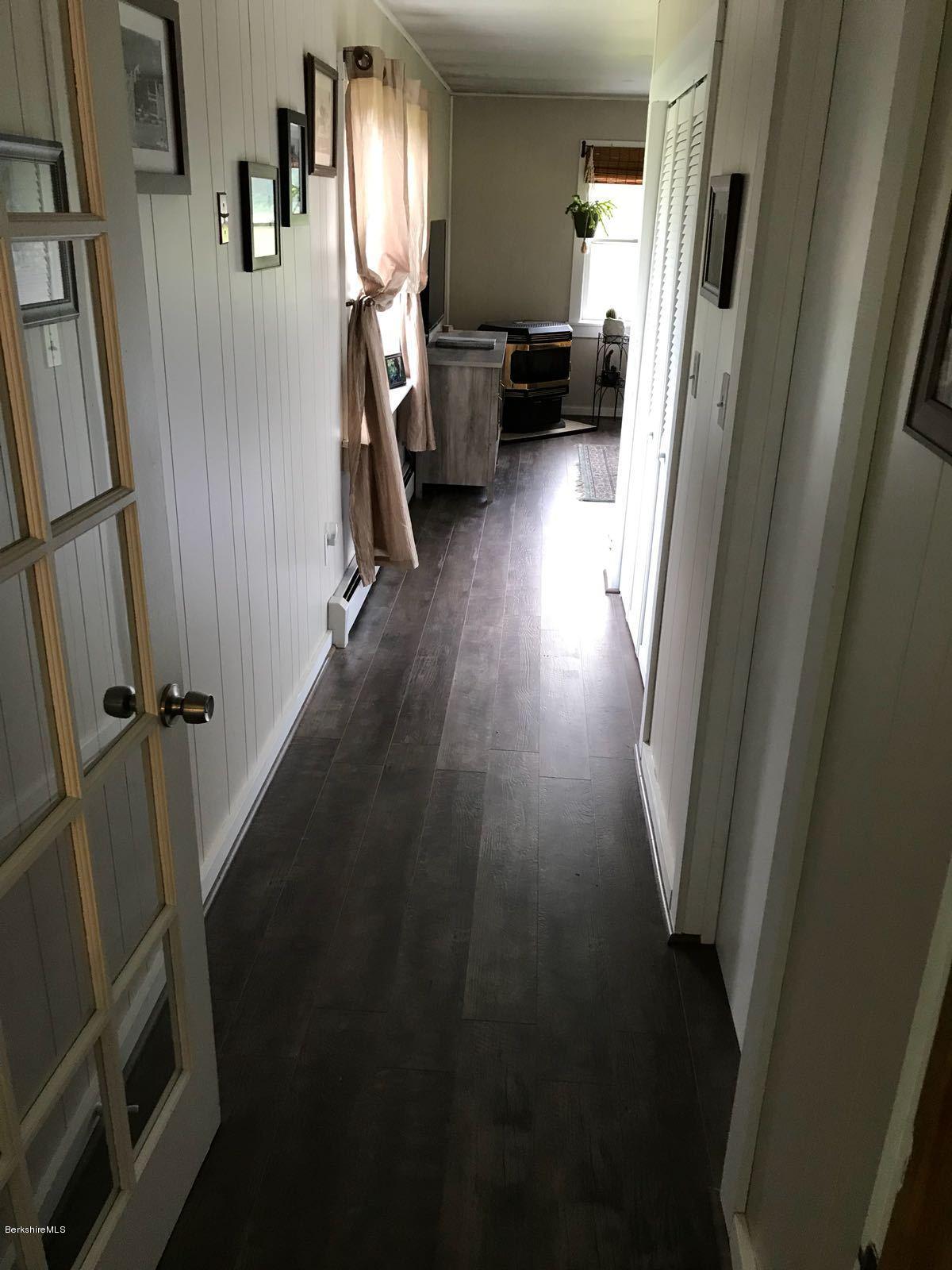1304 Main Road Savoy, MA 01256 - Photo 8 of 28 a view of a hallway with wooden floor and stairs