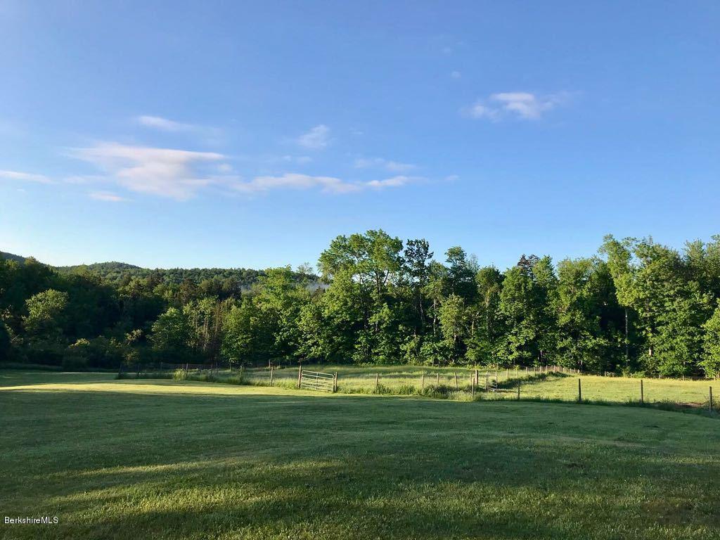 1304 Main Road Savoy, MA 01256 - Photo 9 of 28 a view of a golf course with a lake