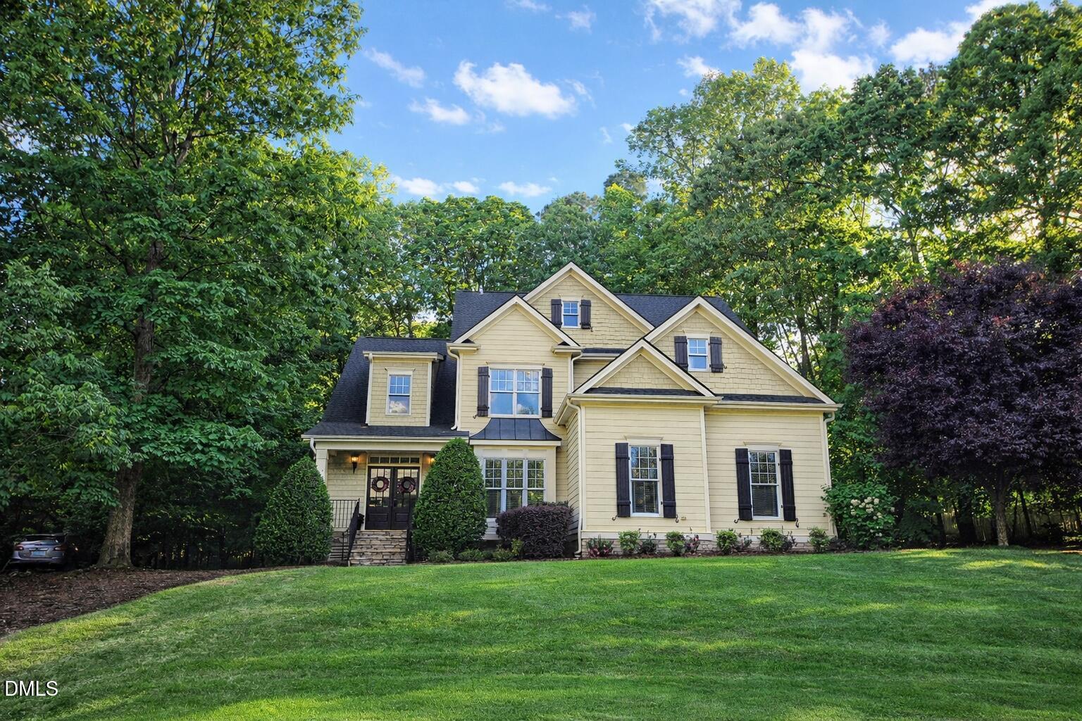a front view of a house with a yard