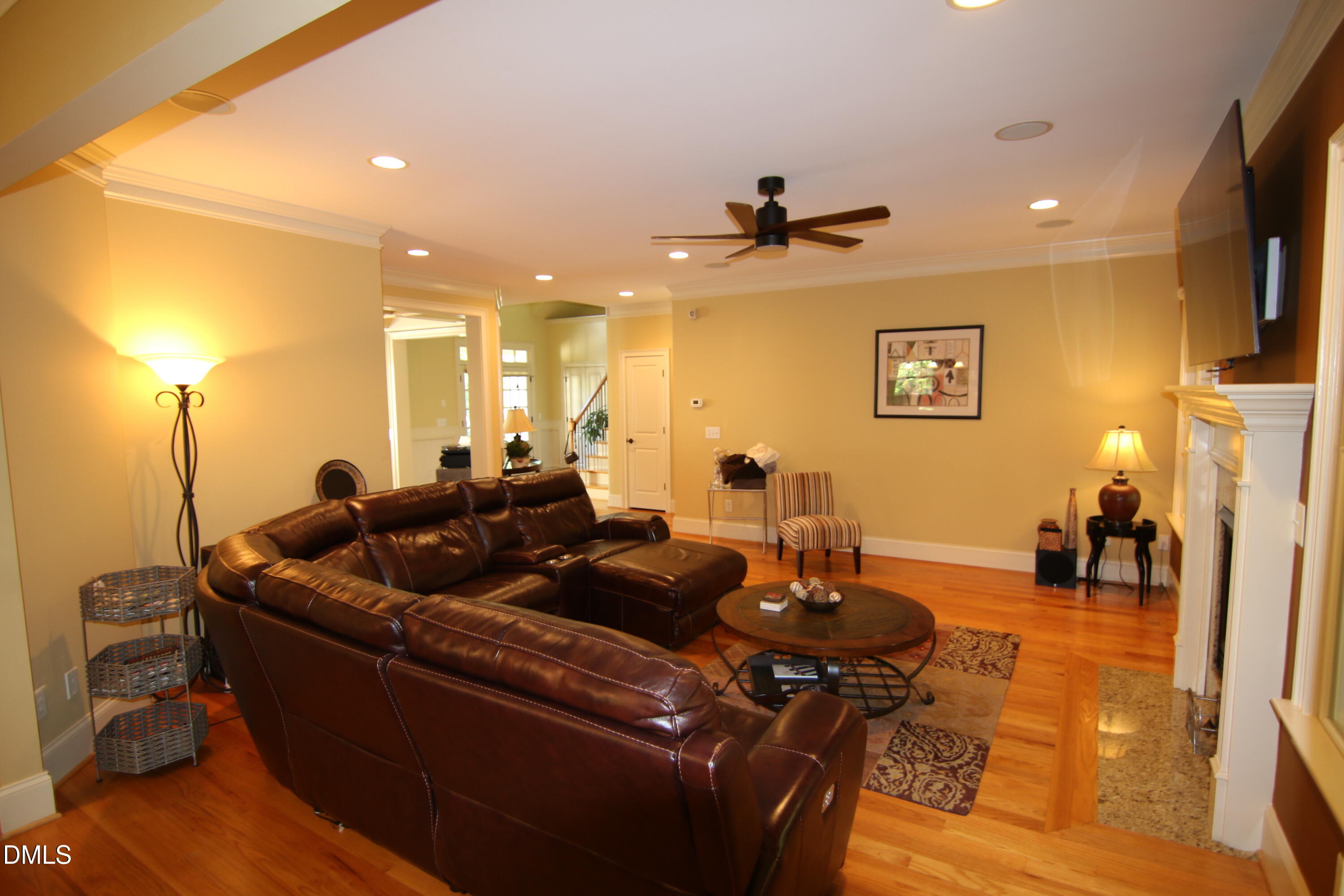 8104 Henderson Road Apex, NC 27539 - Photo 14 of 45 a living room with furniture and a wooden floor