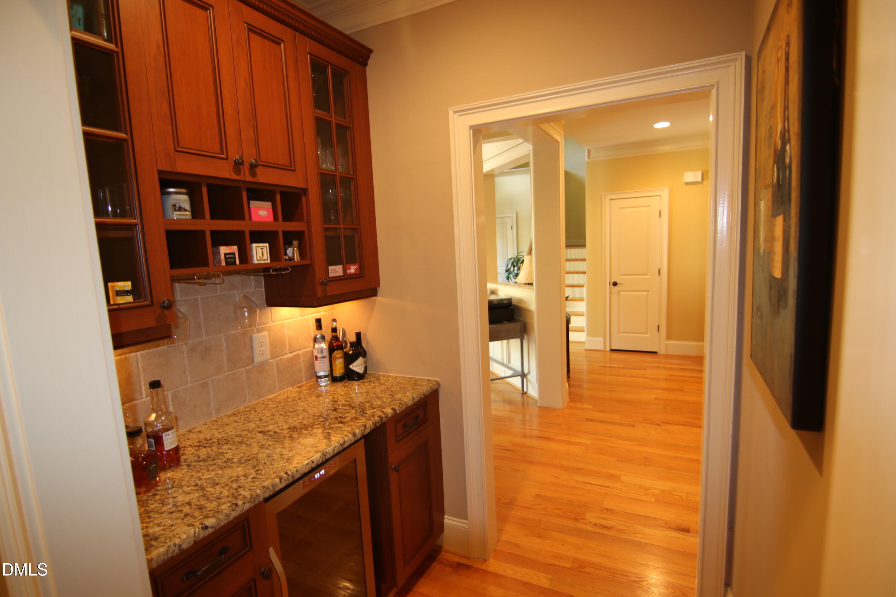 8104 Henderson Road Apex, NC 27539 - Photo 18 of 45 a bathroom with a granite countertop sink and a mirror